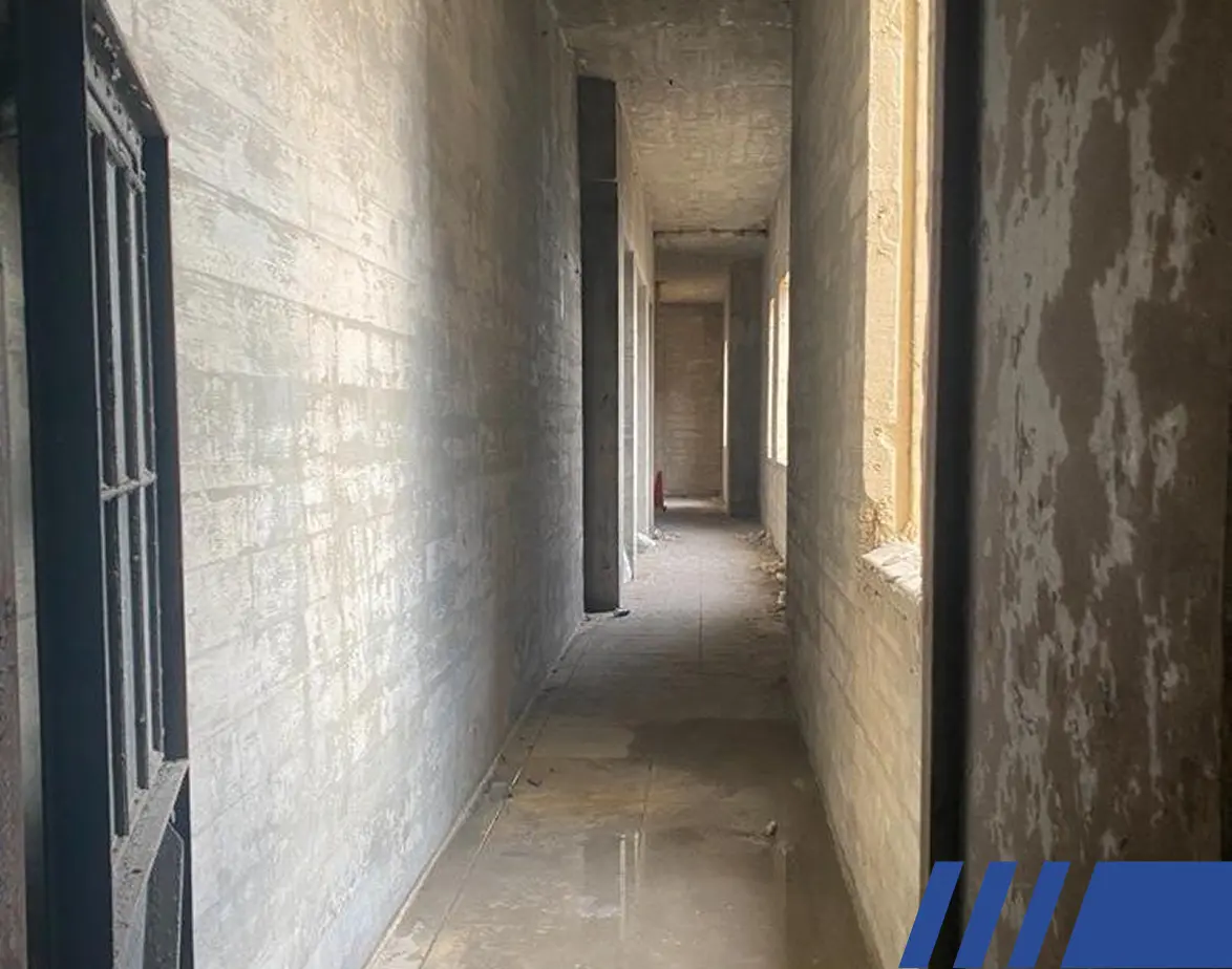 tight hallway that will turn into spatial demo Pre-Demolition Surveys and Independent Inspection