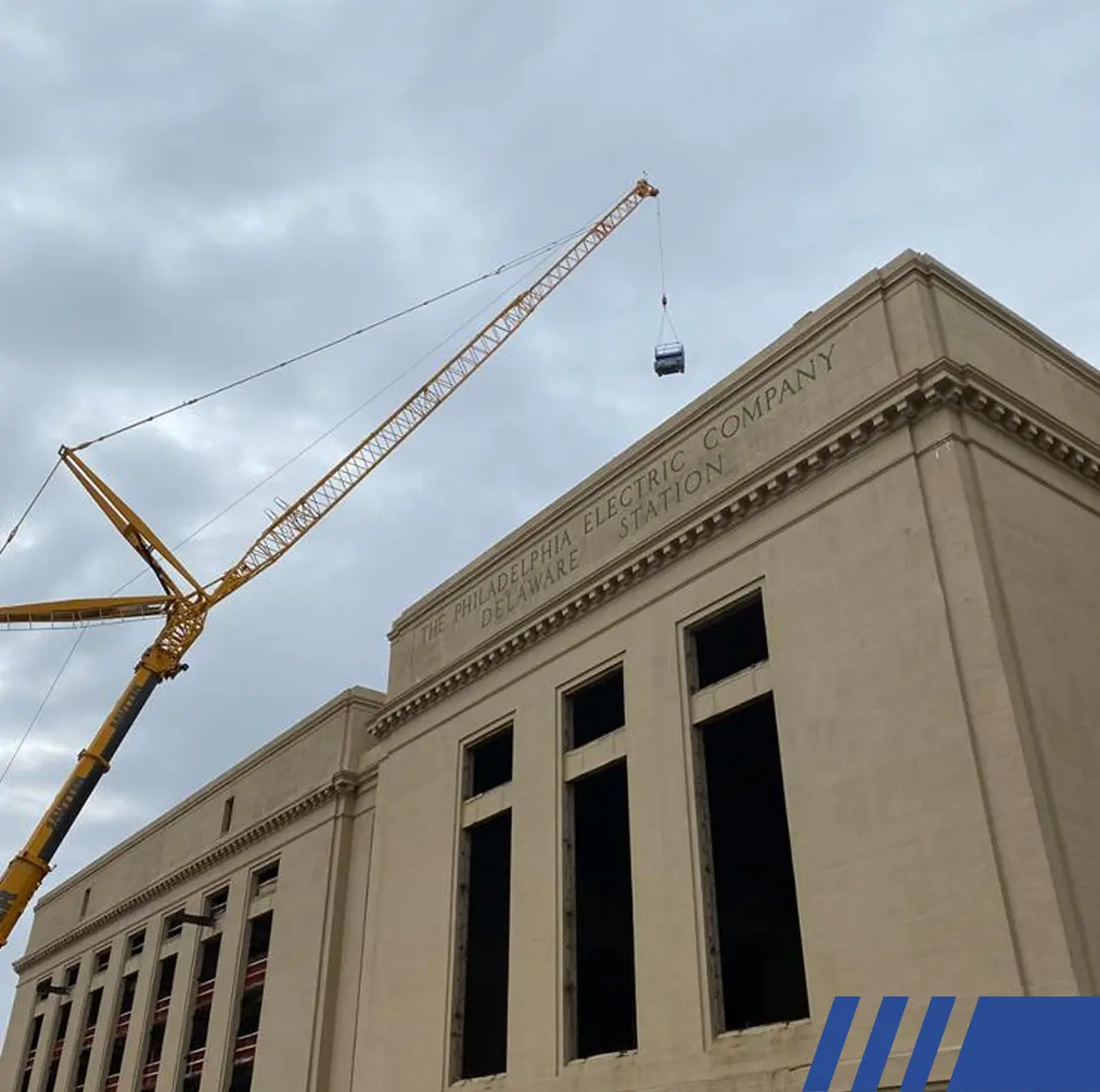 crane getting on roof at deleware station
